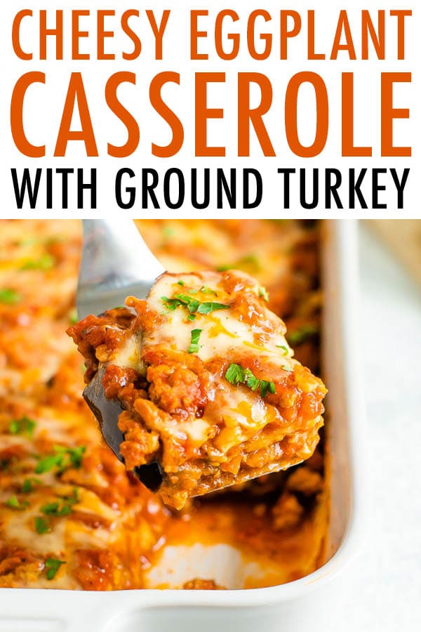 Spatula lifting a slice of cheesy eggplant casserole from the casserole dish.