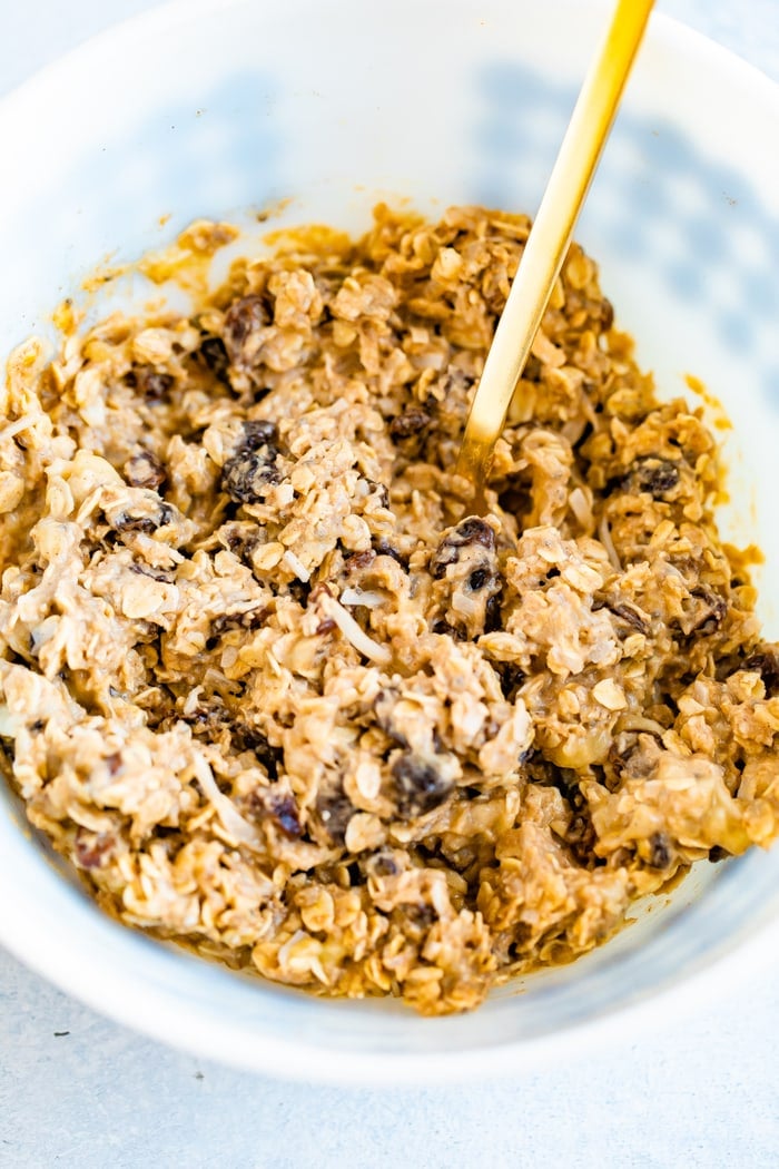 Mixing bowl with the batter for oatmeal raisin protein cookies.