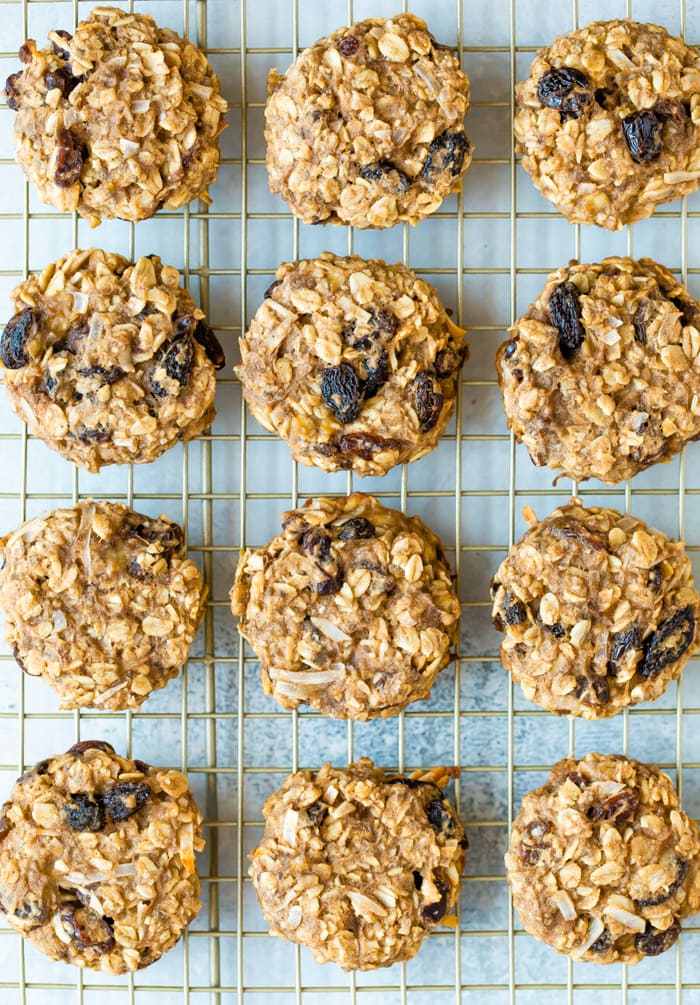 Oatmeal raisin protein cookies on a cooling rack.