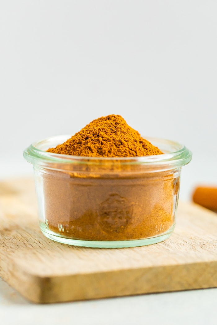 Glass jar filled with homemade pumpkin pie spice.