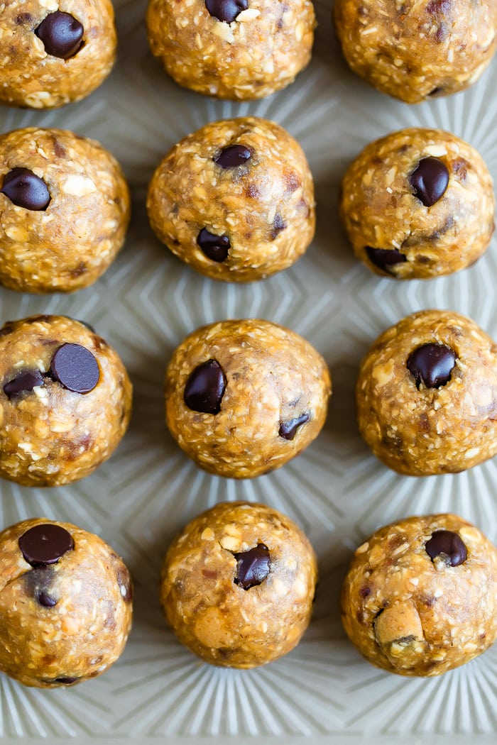 Cookies sheet with rows of no bake chocolate chip lactation bites.