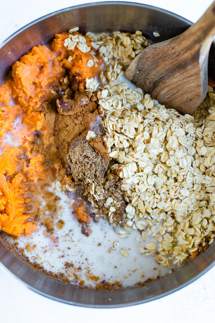 Mixing bowl with ingredients for sweet potato baked oatmeal.