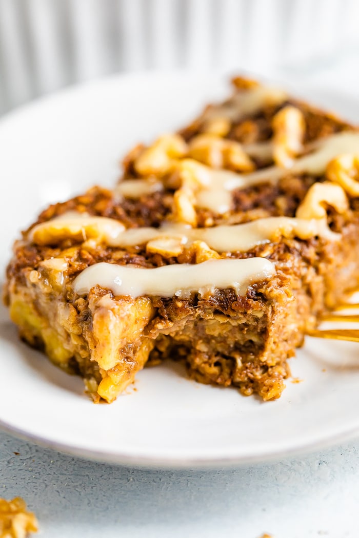 Slice of gingerbread baked oatmeal with a bite taken out of it.