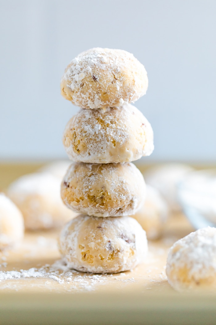 Stack of four snowball cookies.