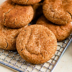 Healthy snickerdoodle cookies on a gold cookie tray.