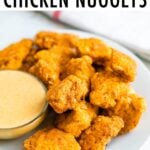 Plate of healthy baked chicken nuggets with an almond flour breading.