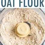 Food processor with blended oats made into oat flour.