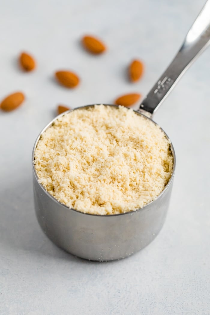 Measuring cup with almond flour.