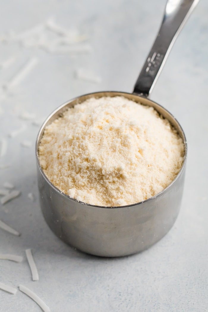 Coconut flour in a measuring cup.