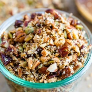 Glass jar with hemp granola made with nuts and seeds.
