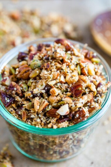 Glass jar with hemp granola made with nuts and seeds.