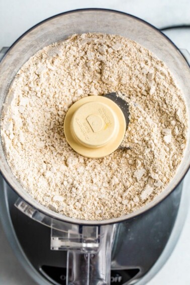 Food processor with blended oats that are now oat flour.