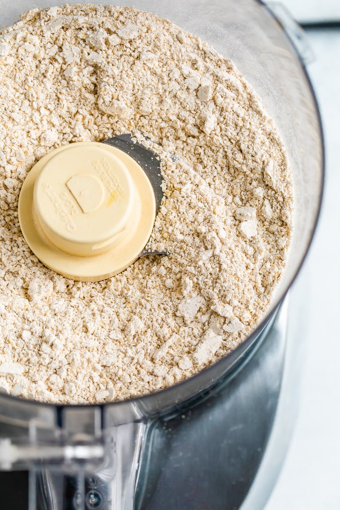 Food processor with blended oats that are now oat flour.