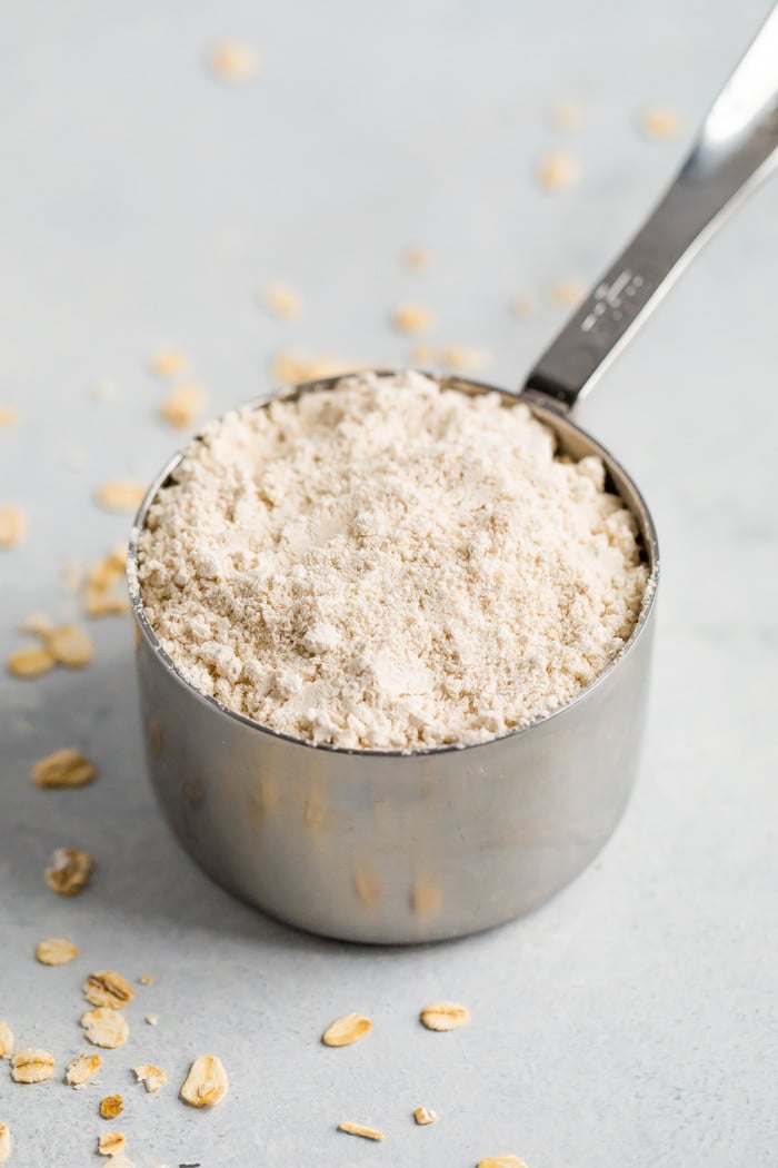 Measuring cup with oat flour.