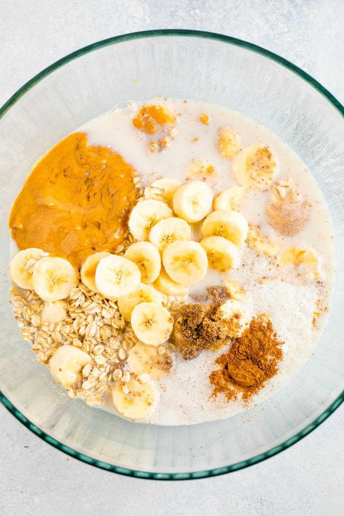 Ingredients for peanut butter baked oatmeal in a mixing bowl.