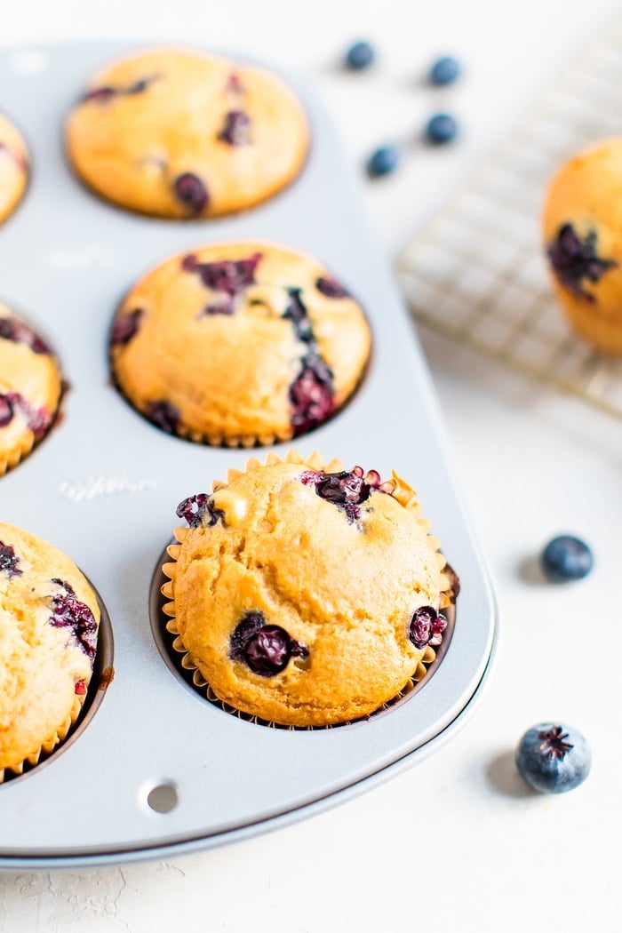 Blueberry muffins in a muffin tin.
