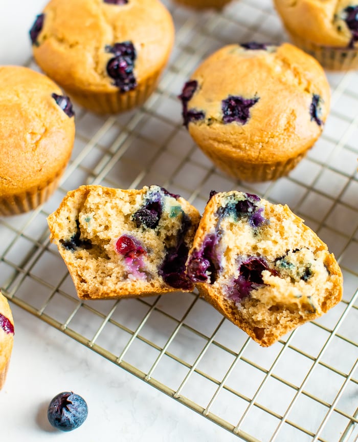 Muffin split in half on a cooking rack.