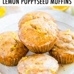 Lemon poppyseed muffins on a plate and topped with glaze.