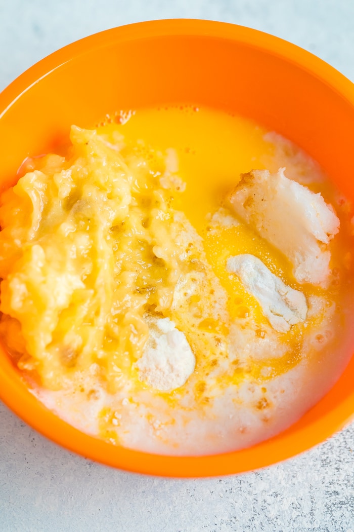 Ingredients for coconut flour banana mug cake in a mixing bowl.