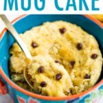 Chocolate Chip Mug Cake in a mug with a spoon scooping a bite.