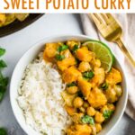 Bowl with half rice and half sweet potato chickpea curry topped with cilantro and lime.