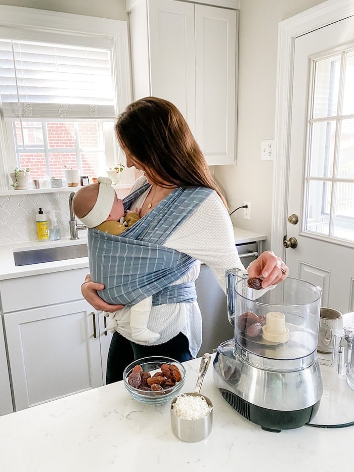 Mom and baby in a kitchen cooking.