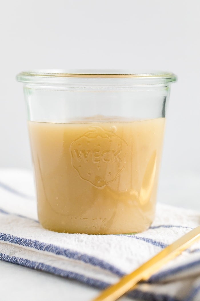 Glass jar of sweetened condensed coconut milk.