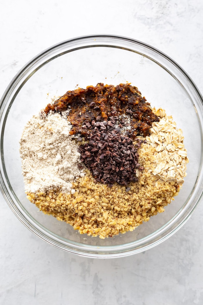 Mixing bowl with the ingredients to make fruit and nut bars.