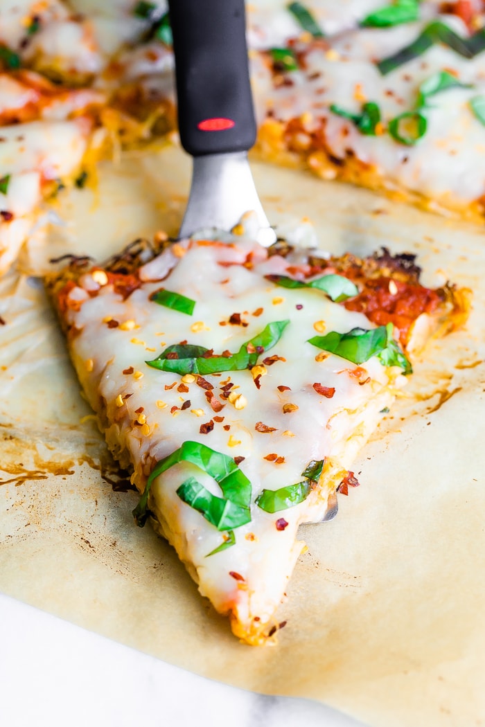 Spatula with a slice of spaghetti squash pizza on it.