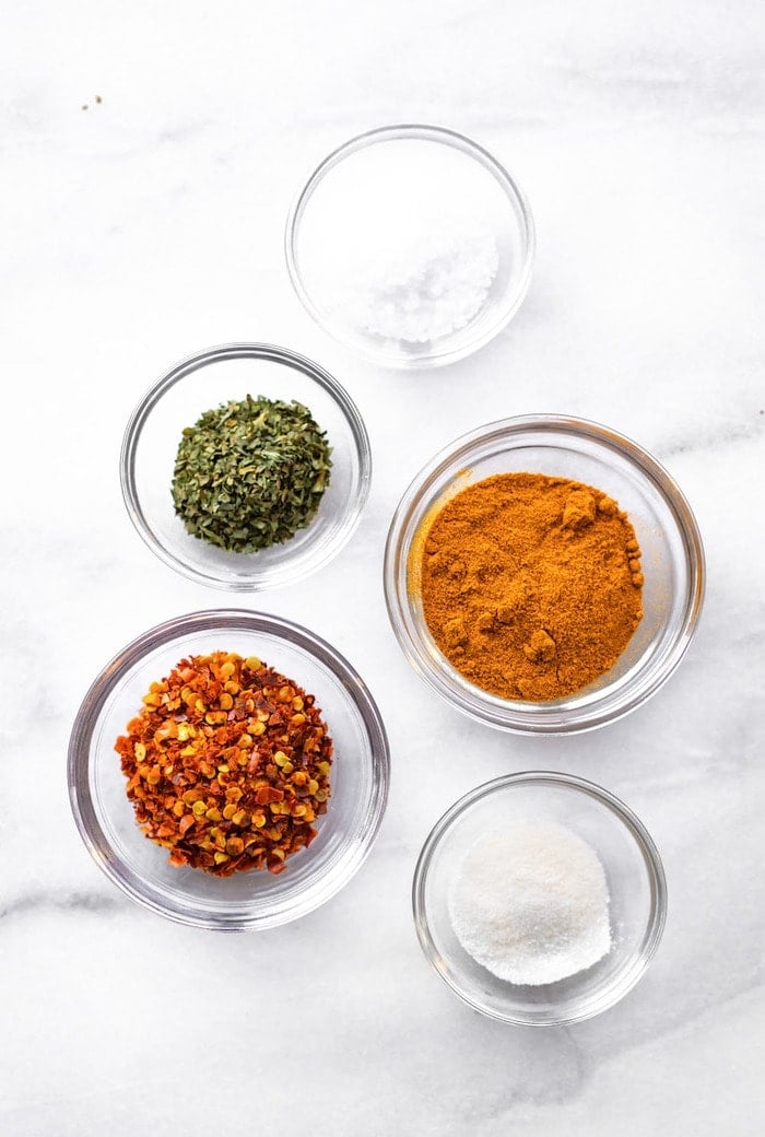 Ingredients measured out in glass bowls.