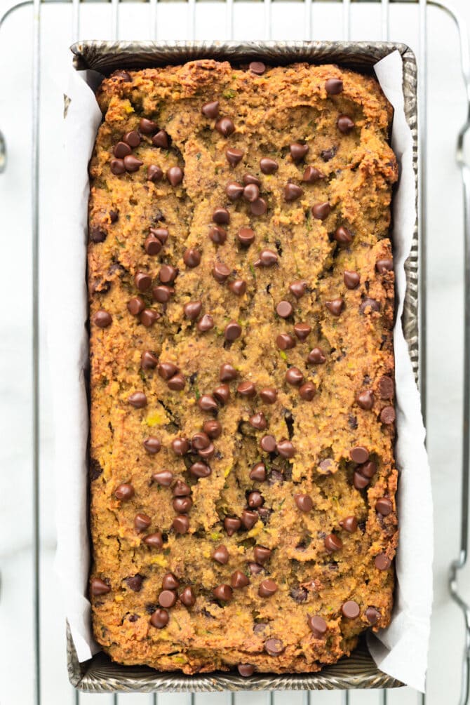 Loaf pan of chocolate chip zucchini bread.