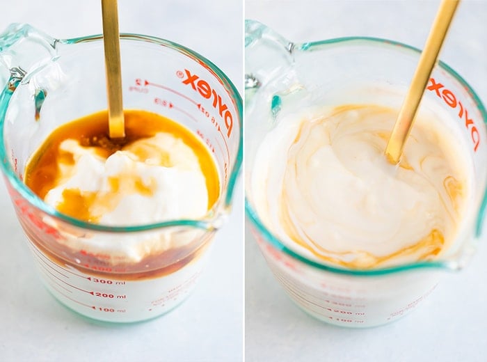 Yogurt mixed with maple syrup and vanilla in a glass Pyrex measuring cup.