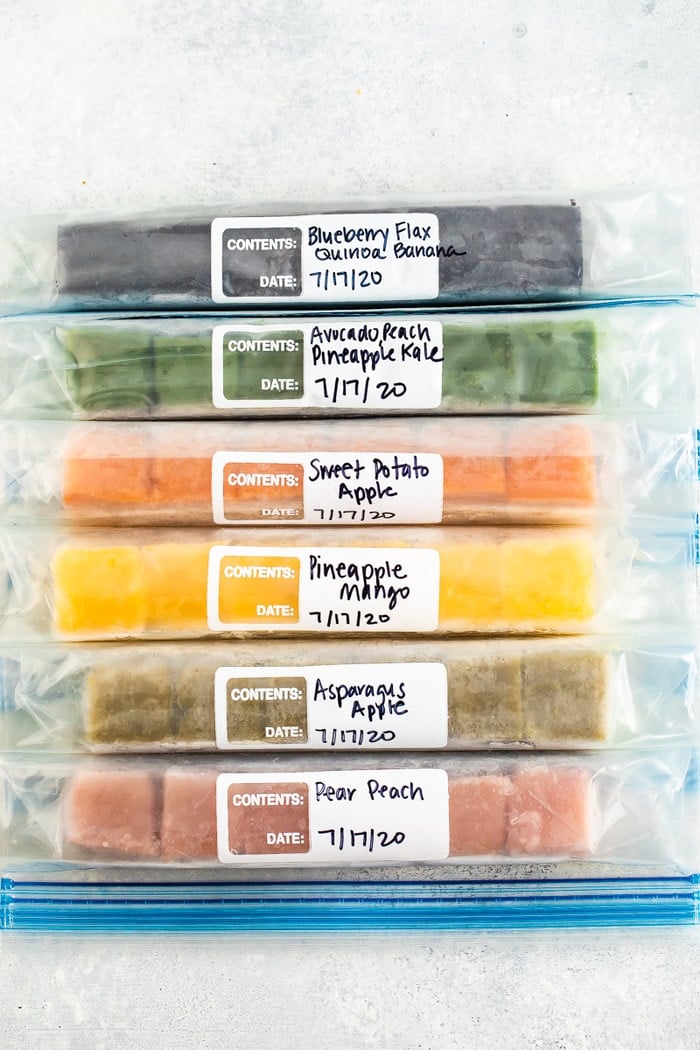 6 Freezer bags with colorful cubes of frozen baby food.