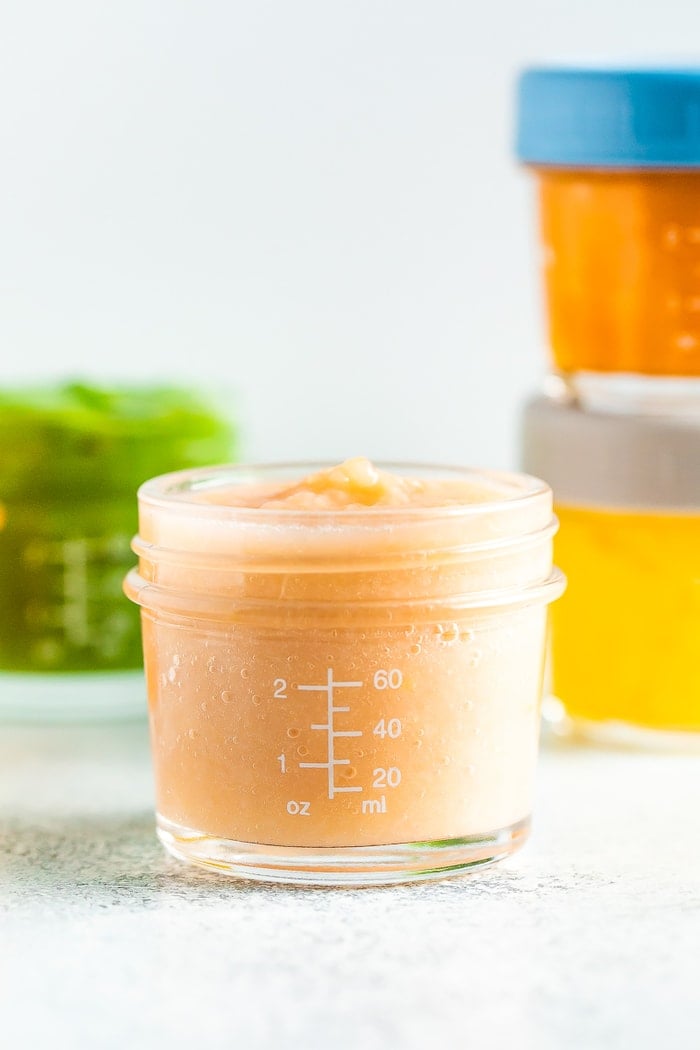 Peach pear baby food in a 4 oz baby food jar.