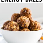 White bowl full of coconut chocolate chip energy balls.