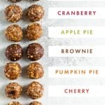 Photo of 10 different flavors of energy balls with labels for their flavors.