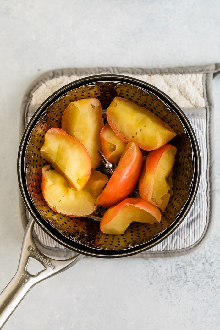 Steamed apples in a steamer basket