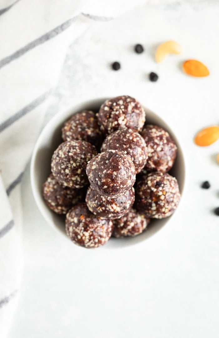 Bird's eye view of a bowl full of blueberry energy balls.