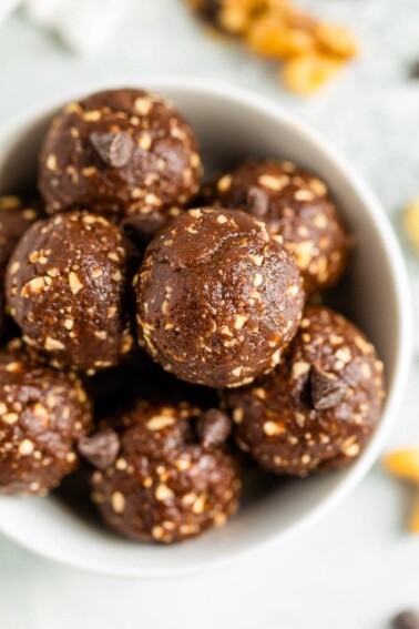 Bird's eye view of a bowl full of brownie energy balls.