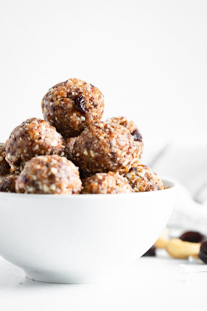 Cherry energy bites in a white bowl.