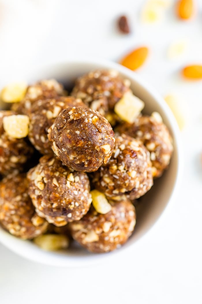 Overhead shot of white bowl with gingerbread energy balls.