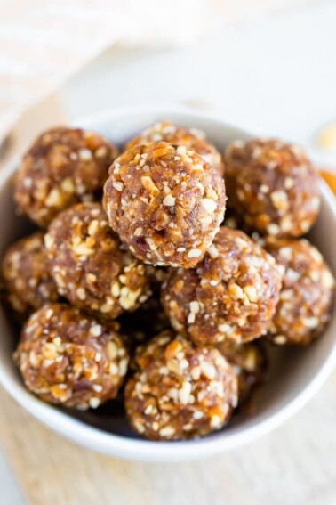 Close up shot of pumpkin pie energy balls in a white bowl.