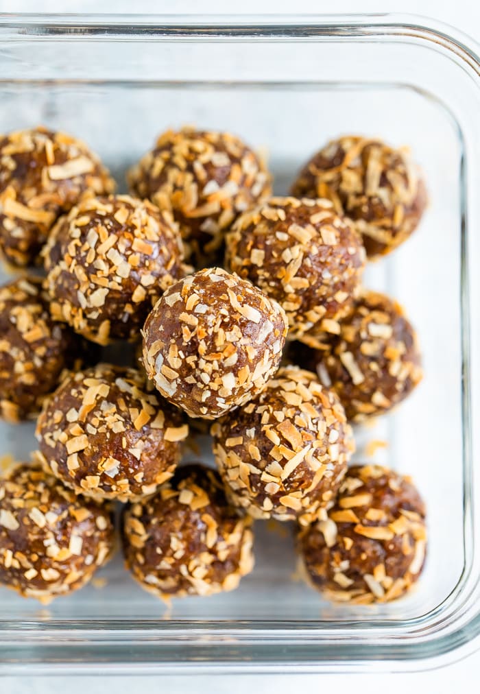 Samoa energy balls in a glass storage container.