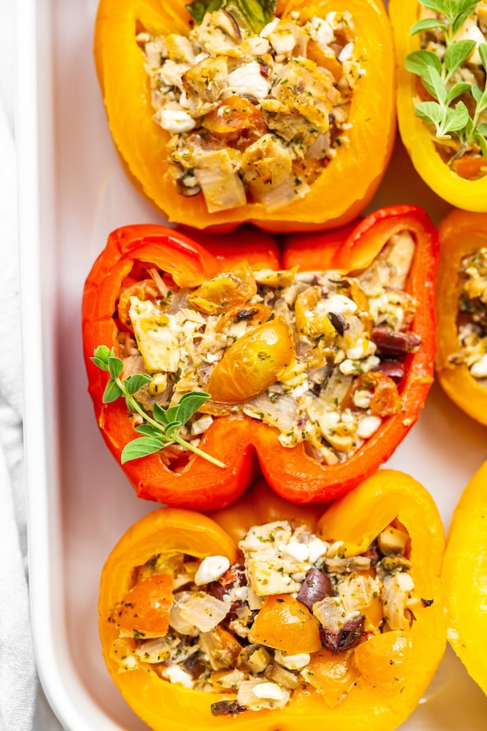 Close up photo of a tuna stuffed bell pepper in a baking dish.