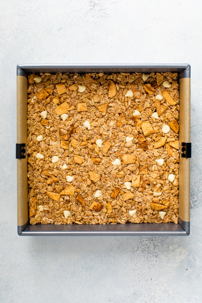 Squash baking pan with apple granola bar mixture.