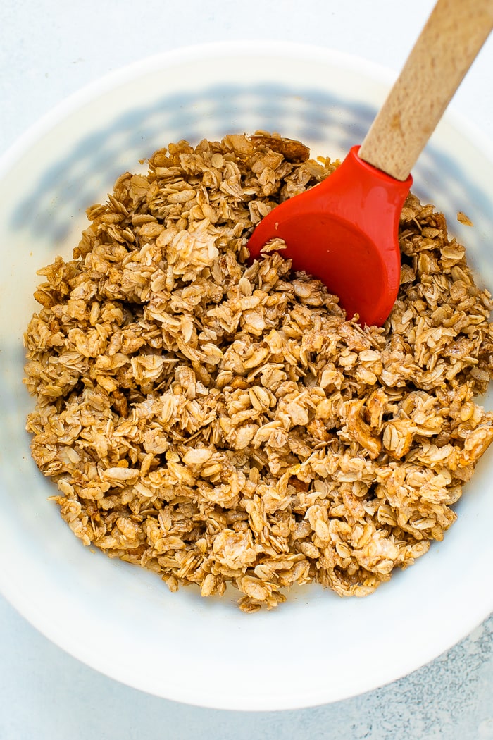 Mixing bowl with oat and apple mixture for granola bars.