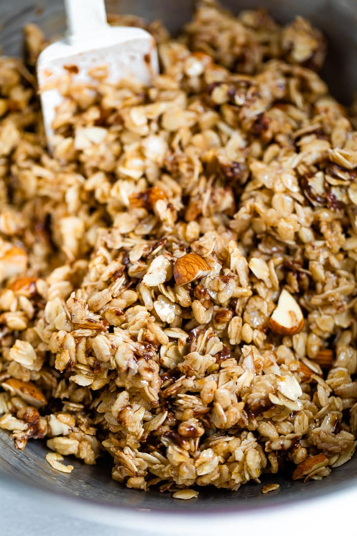 Mixing bowl with mixture for chocolate chip almond granola bars.