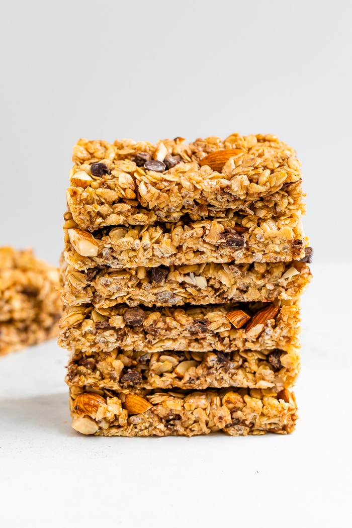 A neat stack of 6 chocolate chip almond granola bars.