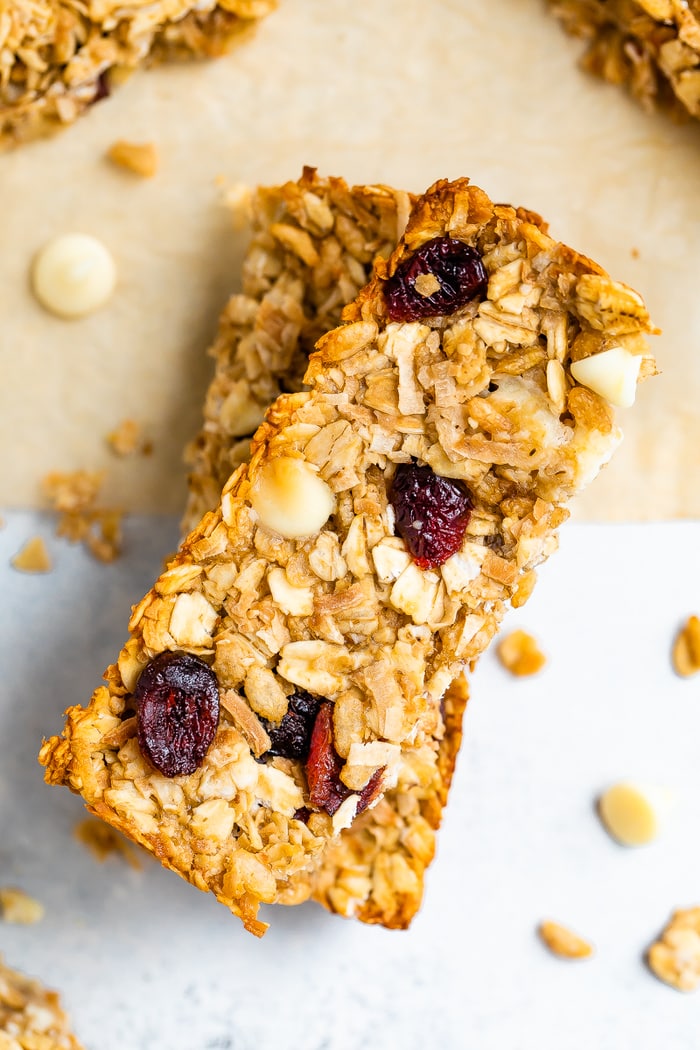 Two cranberry granola bars stacked.