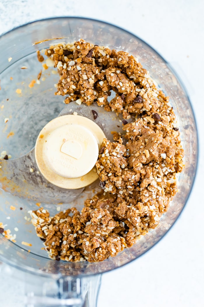 Date energy ball dough with protein powder in a food processor.